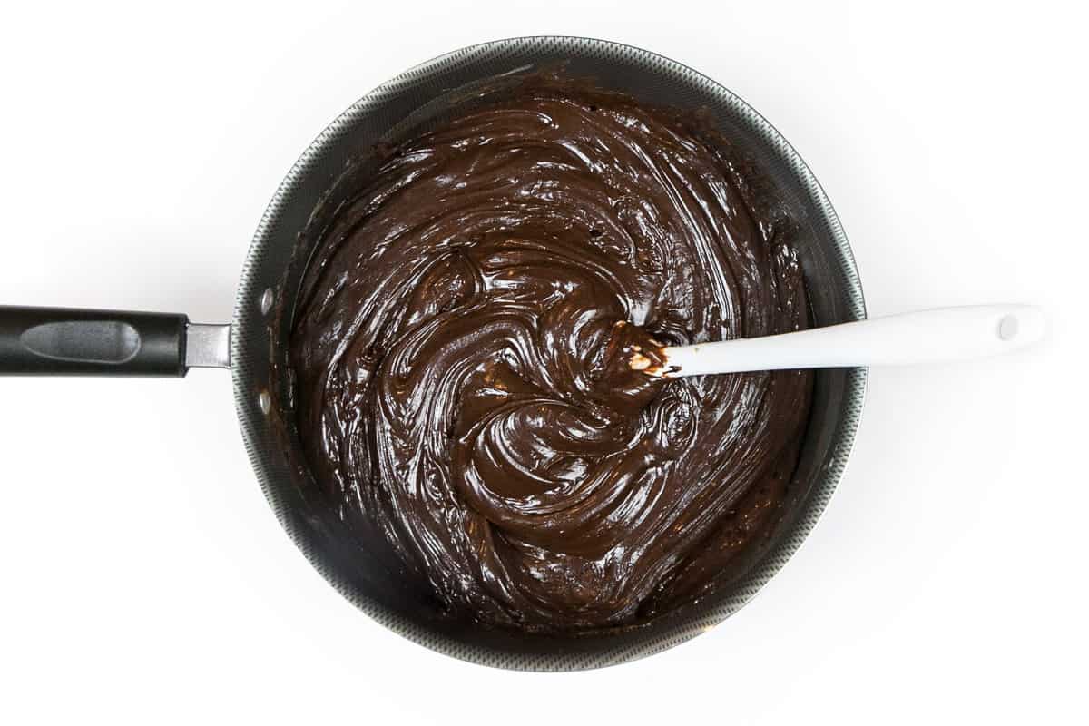 The fudge mixture is melting on the burner.