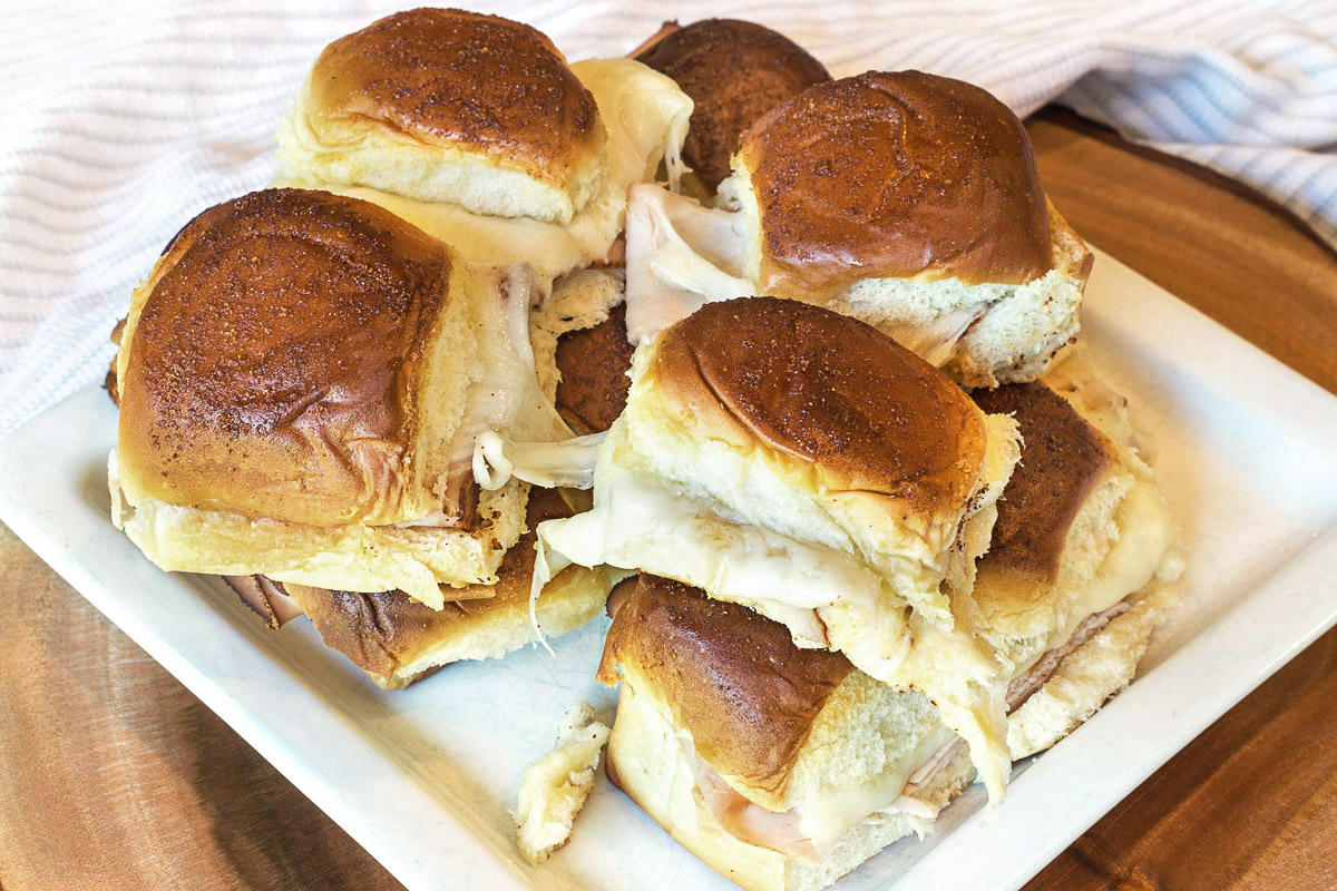 Turkey Sliders on Hawaiian Rolls on a plate.